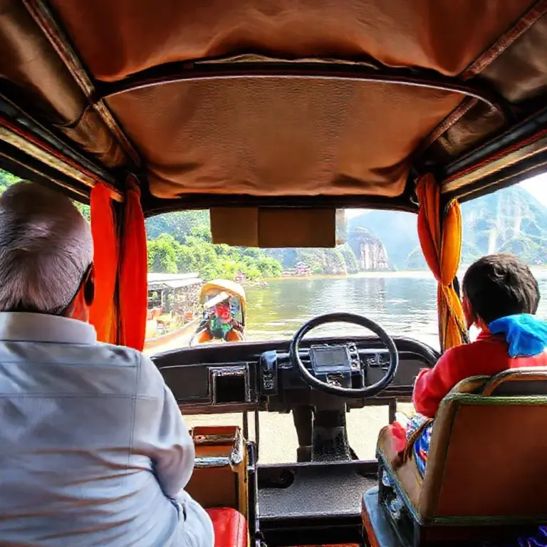 How to get there and navigate locally — transport options, guided tours vs independent travel, and day-trip logistics from Luang Prabang